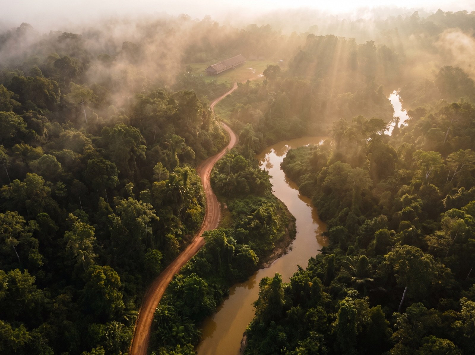 Aerial view of the winding road and river into the Ulu Entabai interior